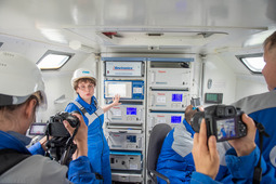 Lyubov Konovalenko, Head of ecological and analytical laboratory of Company, showing and describing for journalists operating principles of mobile laboratory facility.